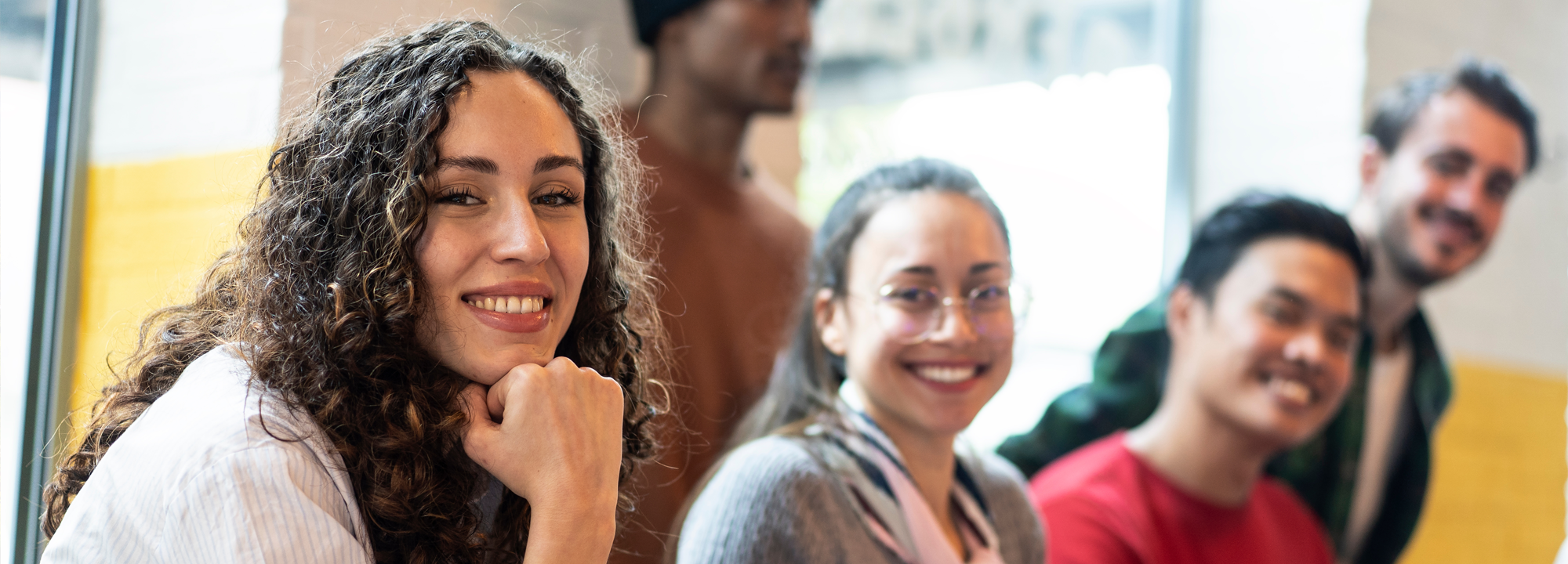 College students studying and smiling