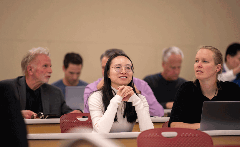 Faculty listening to a presentation